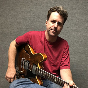 Kevin Tiernan   Mandolin, Dobro, Guitar,Bass, Ukulele  Kevin Tiernan received his Bachelor's Degree from USC's Thornton Studio Guitar Performance program and has enjoyed playing in musicals with Grammy &amp; Tony award winning composers &amp; performers. Kevin has taught for over 20 years.