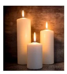 3 white candles lit of varied size