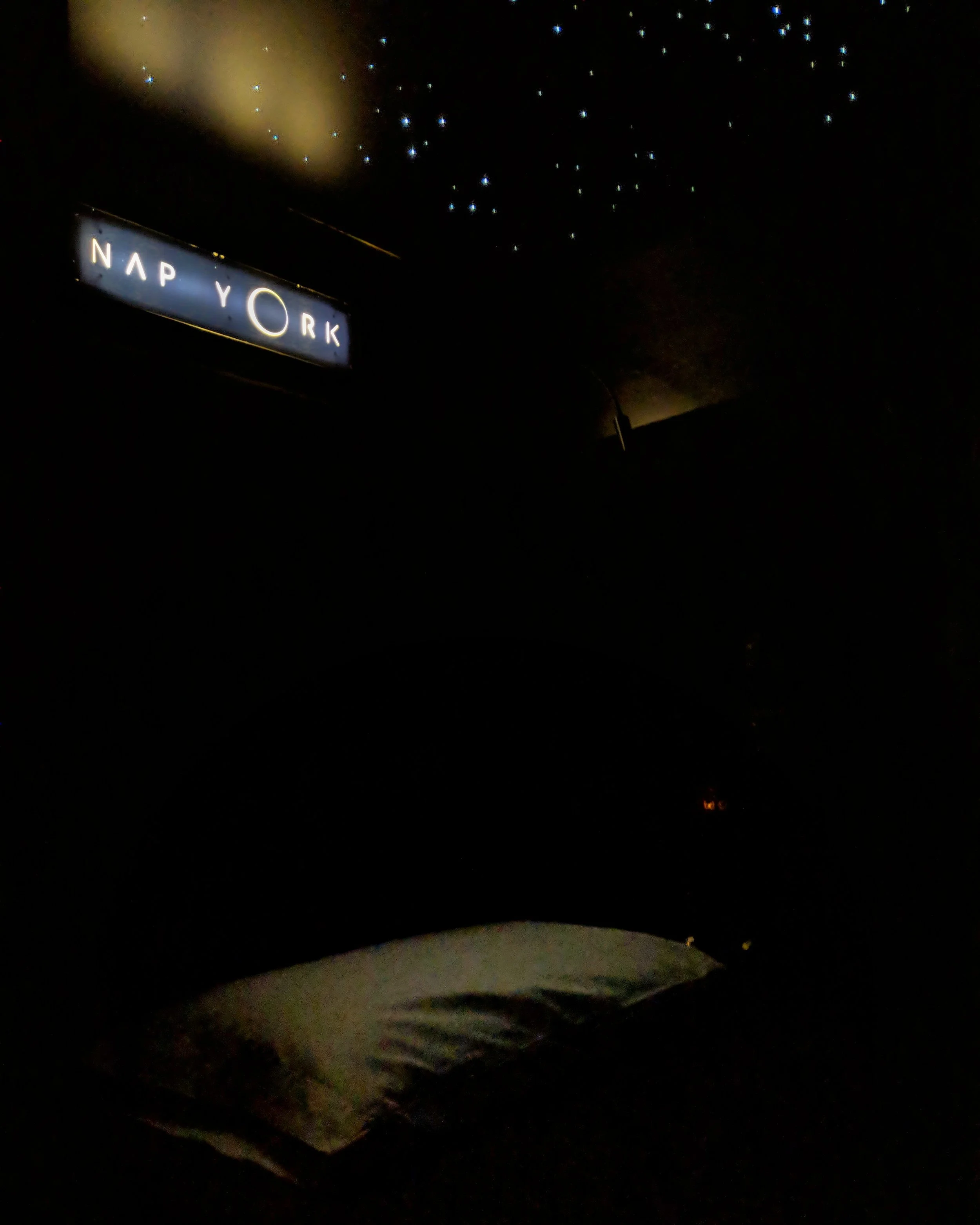 My pod with the lights out, minus the stars above the bed.