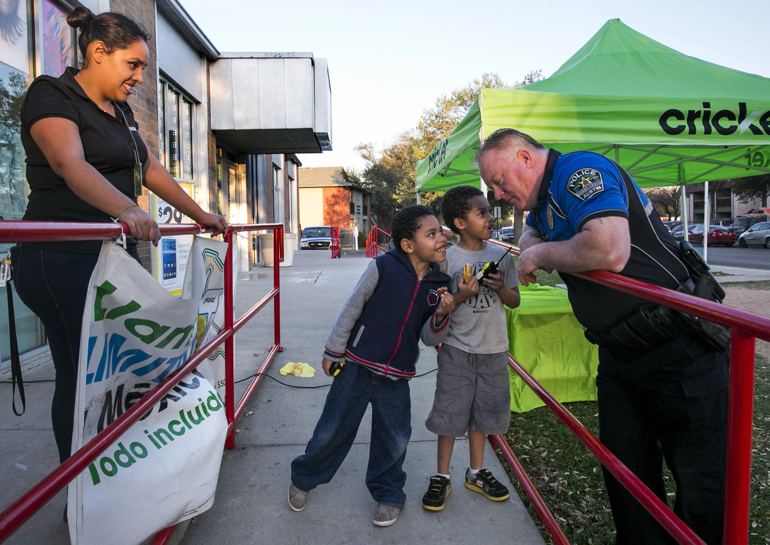  On Feb. 27, 2016, Austin police officer Jack Eastland foot patrolled the Rundberg area of North Austin, stopping to talk to Cricket store manager, Jacky Reyes, and her children, Hector Reyes (left) and Sebastian Reyes (right).The foot patrols are an