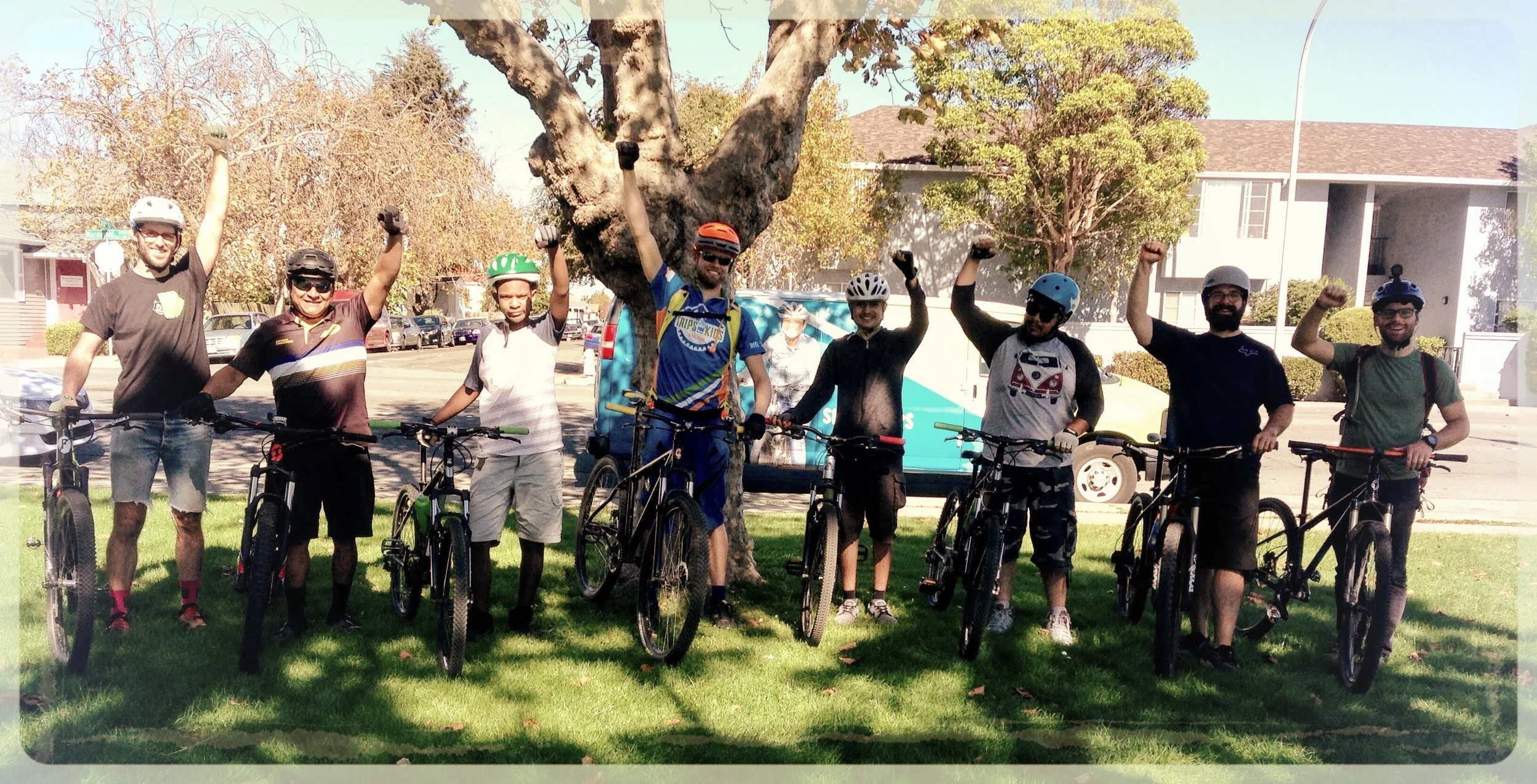 Two student riders and a bunch of enthusiastic adults at the first Fun Ride