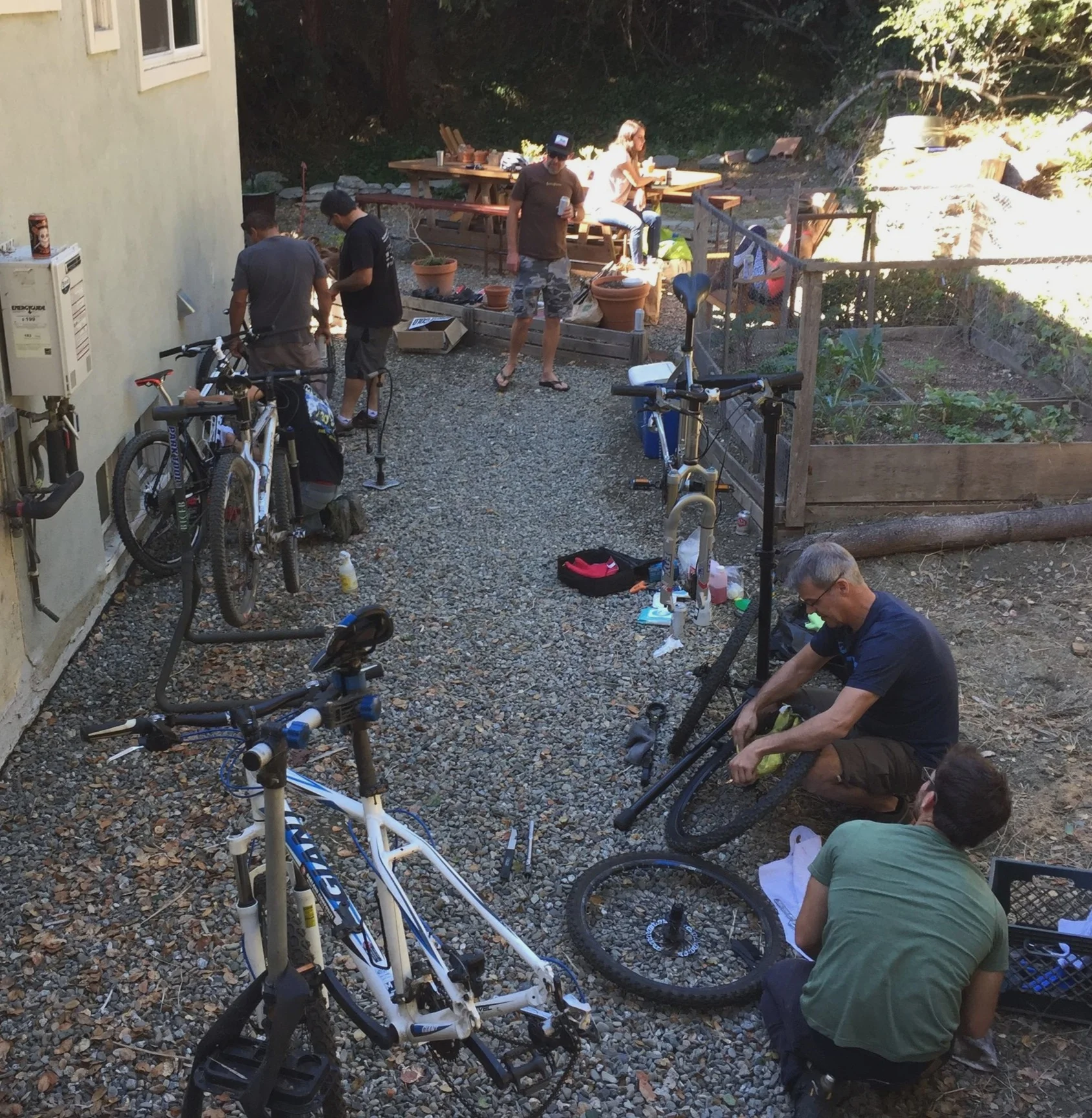 Coaches gather early in the first season to fix up donated bikes to loan out to kids. 80% of team riders need a loaner bike to participate on the team.