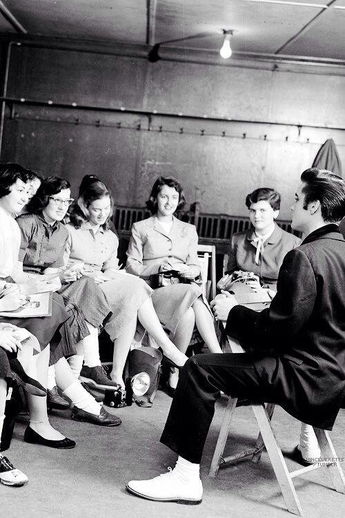 Elvis with a group of women.jpg