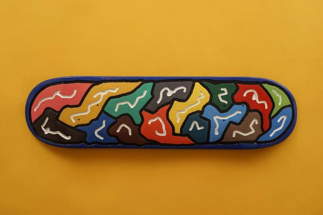 Skateboard deck. Featuring carved lines, with 22 different shades of enamel. *Sold