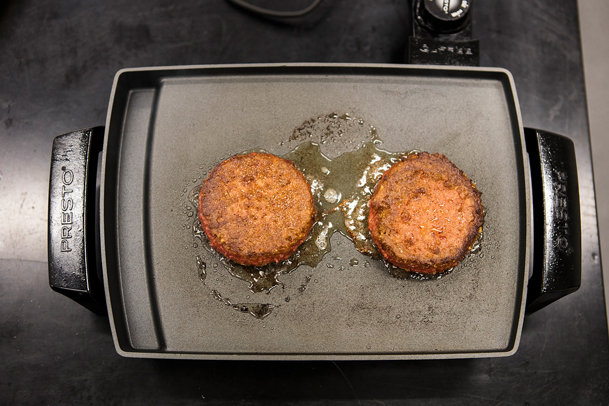 frying up some patties in the beyond meat research lab