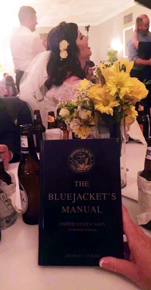 In a recent wedding, The Bluejacket’s Manual was used for a groom whom had served in the Navy. The tradition shared at this event was the passing of The Bluejacket Manual from a current Navy wife, to an incoming Navy wife; a special token that can be on display for years to come with multiple meanings to both spouses.