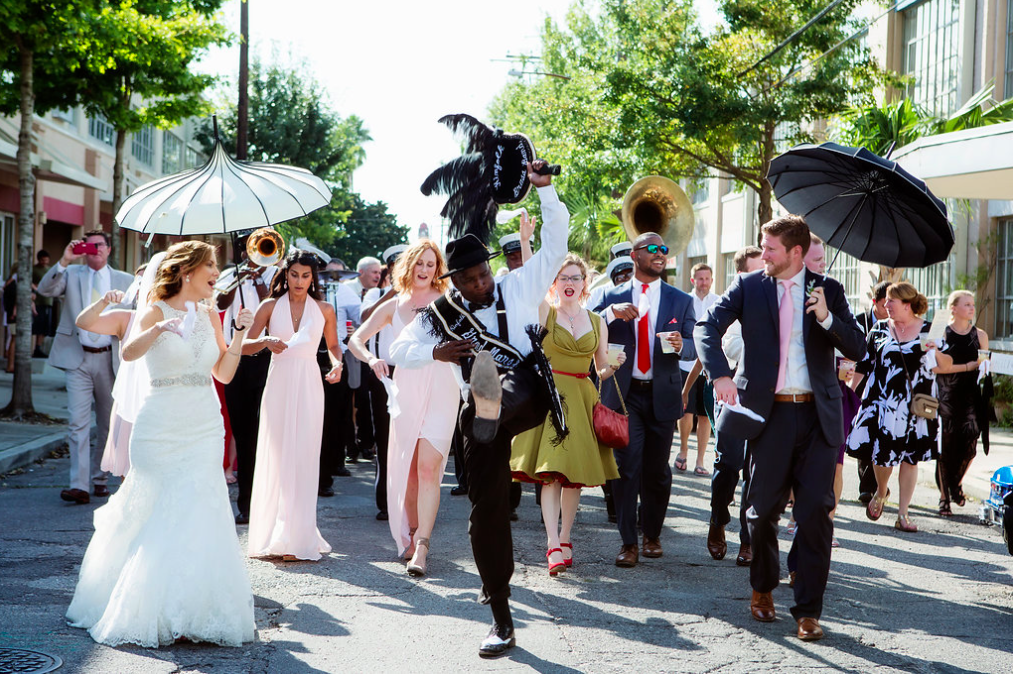 Leading the charge the second line band; Kinfolk Brass Band , lead Ashley and Brian through the streets of New Orleans. A tradition, I personally had at my wedding, and wouldn’t trade for the world! Ashley and Brian can feel the support of their family and friends behind them and start the celebration off with a bang! Captured By: Becky Cooper Photography