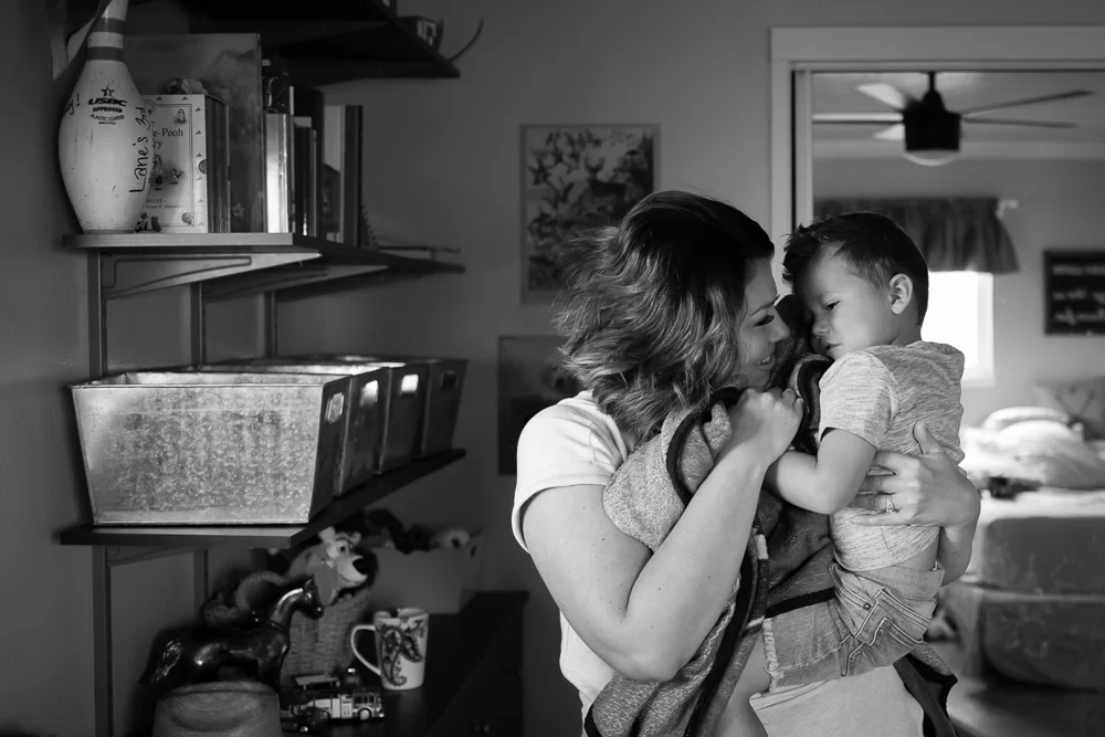 Tonya Edwards | Oroville Family Photographer | mother holding son and his blanket in his bedroom