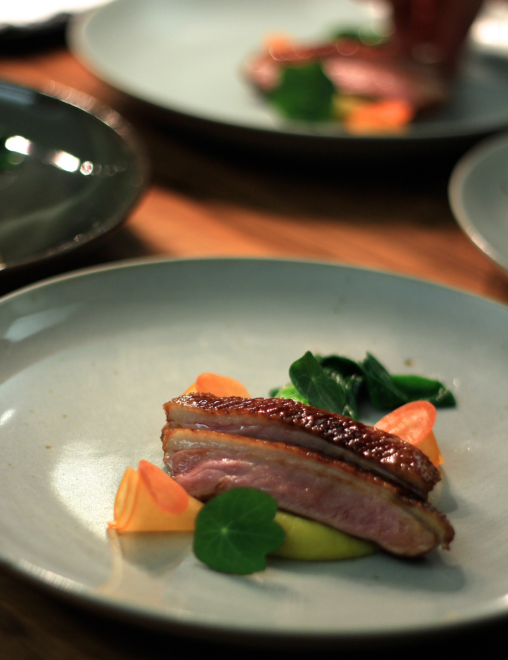 Glazed duck, kumara, bok choy, pickle carrot, persimmon