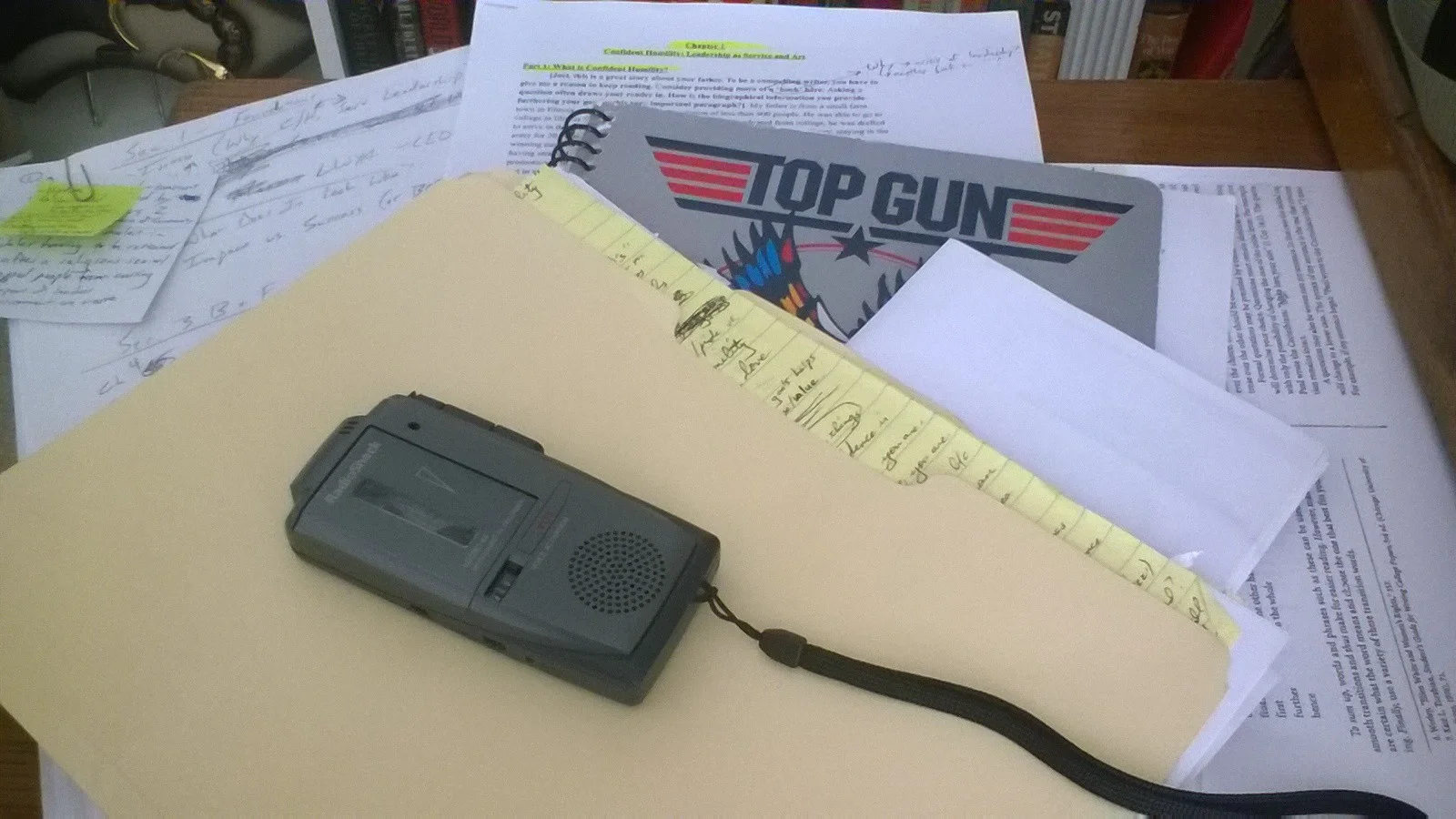 This is what my desk looks like when I work. Notice the mini-cassette recorder: this is how I 'wrote' much of my first draft while making my forty-five minute drive to and from school each day.