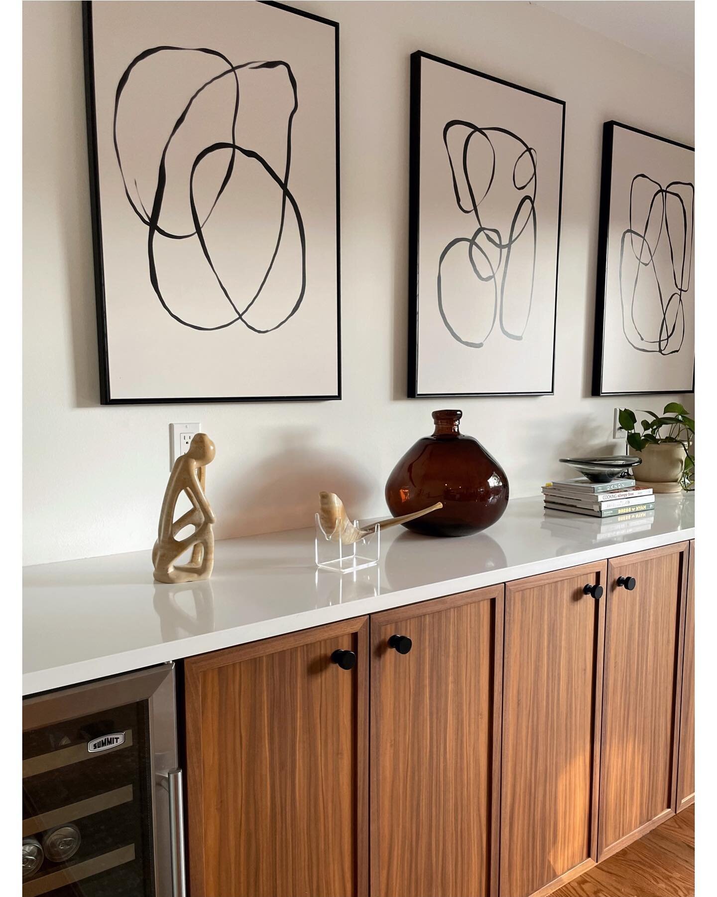 Photo from a recent install at our midcentury project. Built-in bar in walnut  styled with a mix of new and sentimental objects.