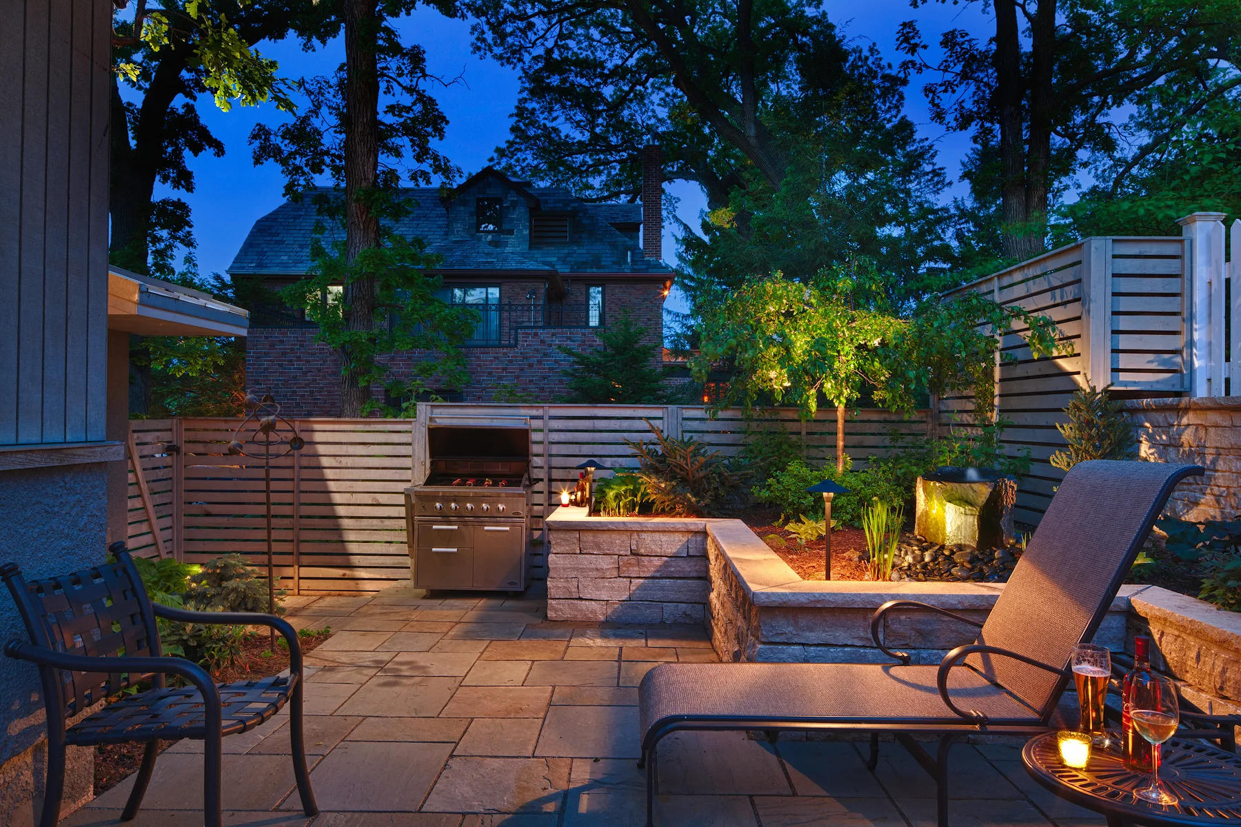 This Minneapolis backyard may be small, but it is full of wonder! Tabor Group Landscape added privacy with space to entertain and relax. 