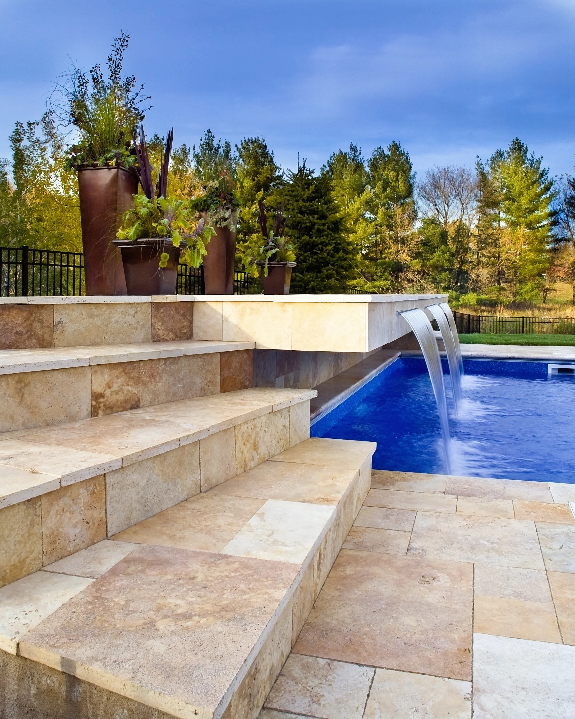 Lake Minnetonka area home enjoys a place to jump, sit or enjoy the sun as it overlooks the beautiful stone tile. 