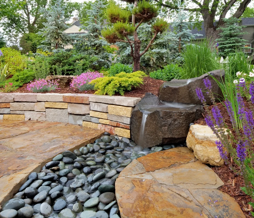 Edina garden has Asian inspiration throughout. The beauty of the landscape combined with the tranquility and serenity of the space melt all your worries away. 