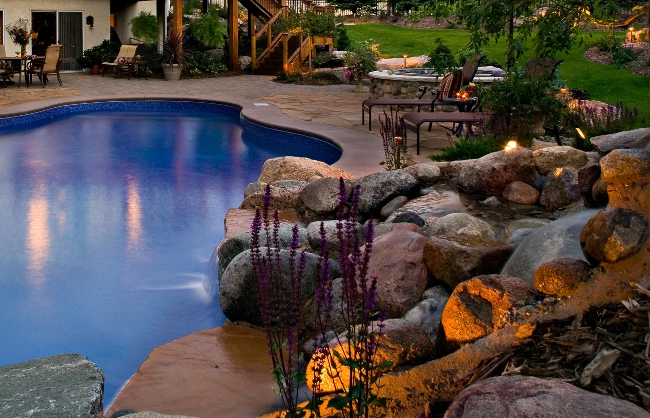 This is not your average pool. A gorgeous- natural in view- waterfall steals the show in this Eden Prairie backyard. 