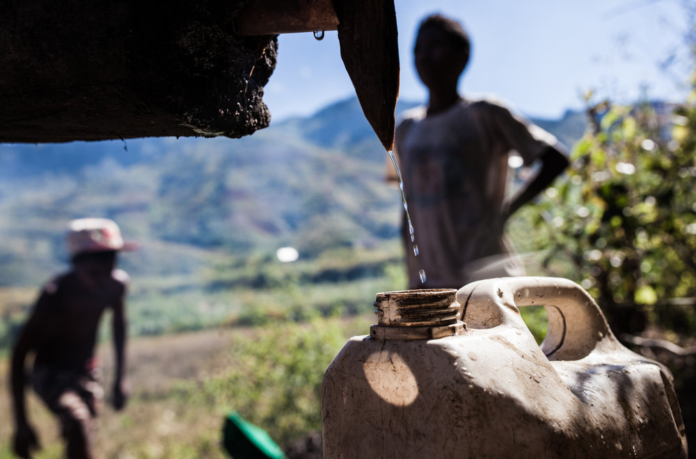  An Irrigation System from a Nearby Spring Cools the Evaporated Moonshine Which is Collected in Jerrycans 