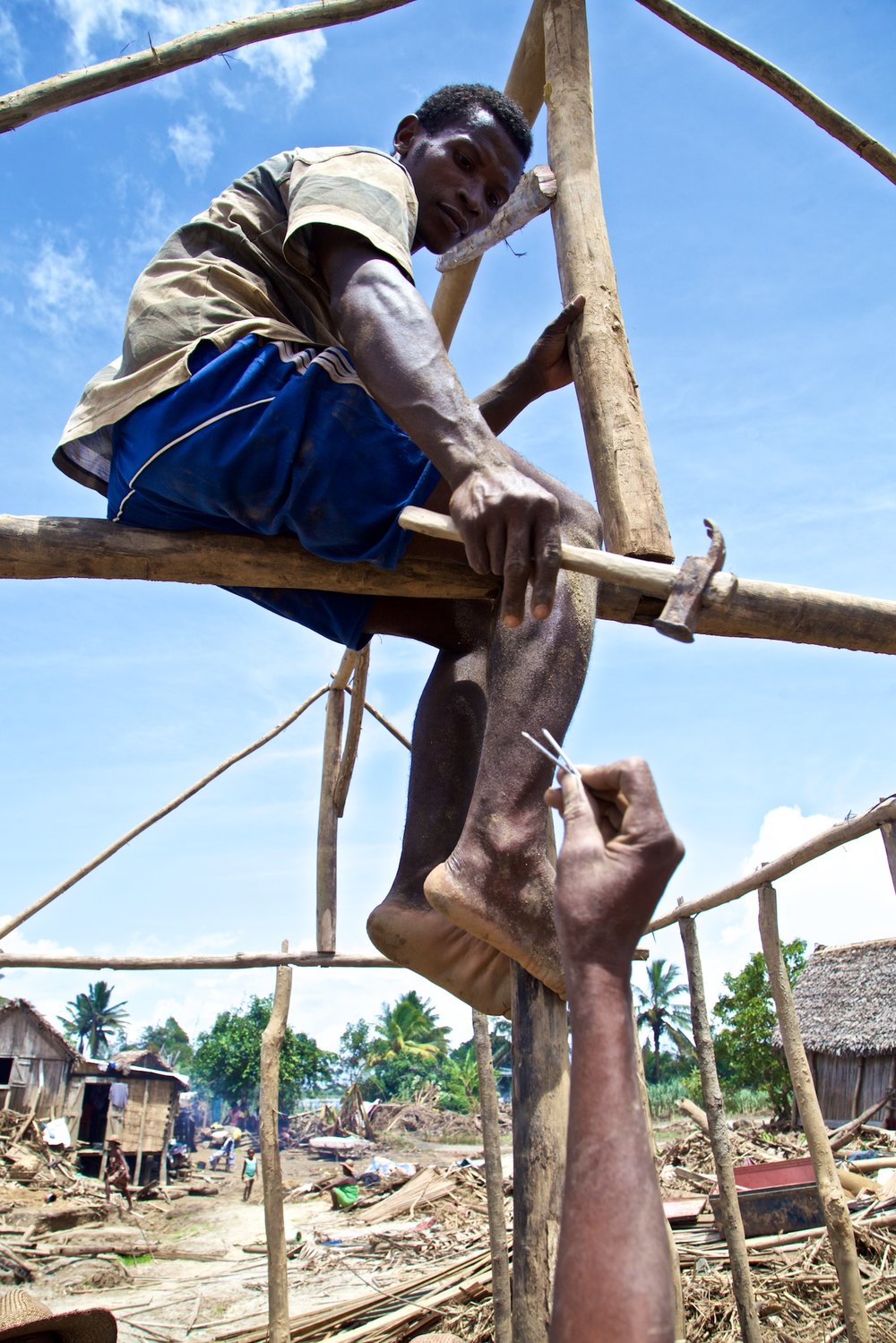 With Urgent Need for Shelter Against the Daily East Coast Rains, Bolo Works with Friends to Reconstruct A House from the Wreckage