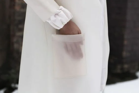 I'm on the fence about this see-through pocket concept. It has a delicate beauty to it. But it also reminds me of the clear backpacks that some kids have to bring to school to make sure they're not hiding knives inside. I am not a schoolchild so I think I'll take my pockets and bags in opaque materials, thanks. Can't find brand reference.