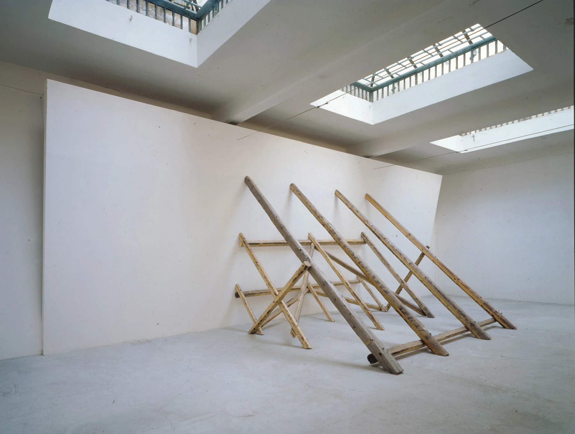 David Lamelas, Untitled (Falling Wall) , 1993, Dry wall, wood, screws, acrylic paint, and reclaimed lumber Courtesy David Lamelas and Maccarone New York/Los Angeles.