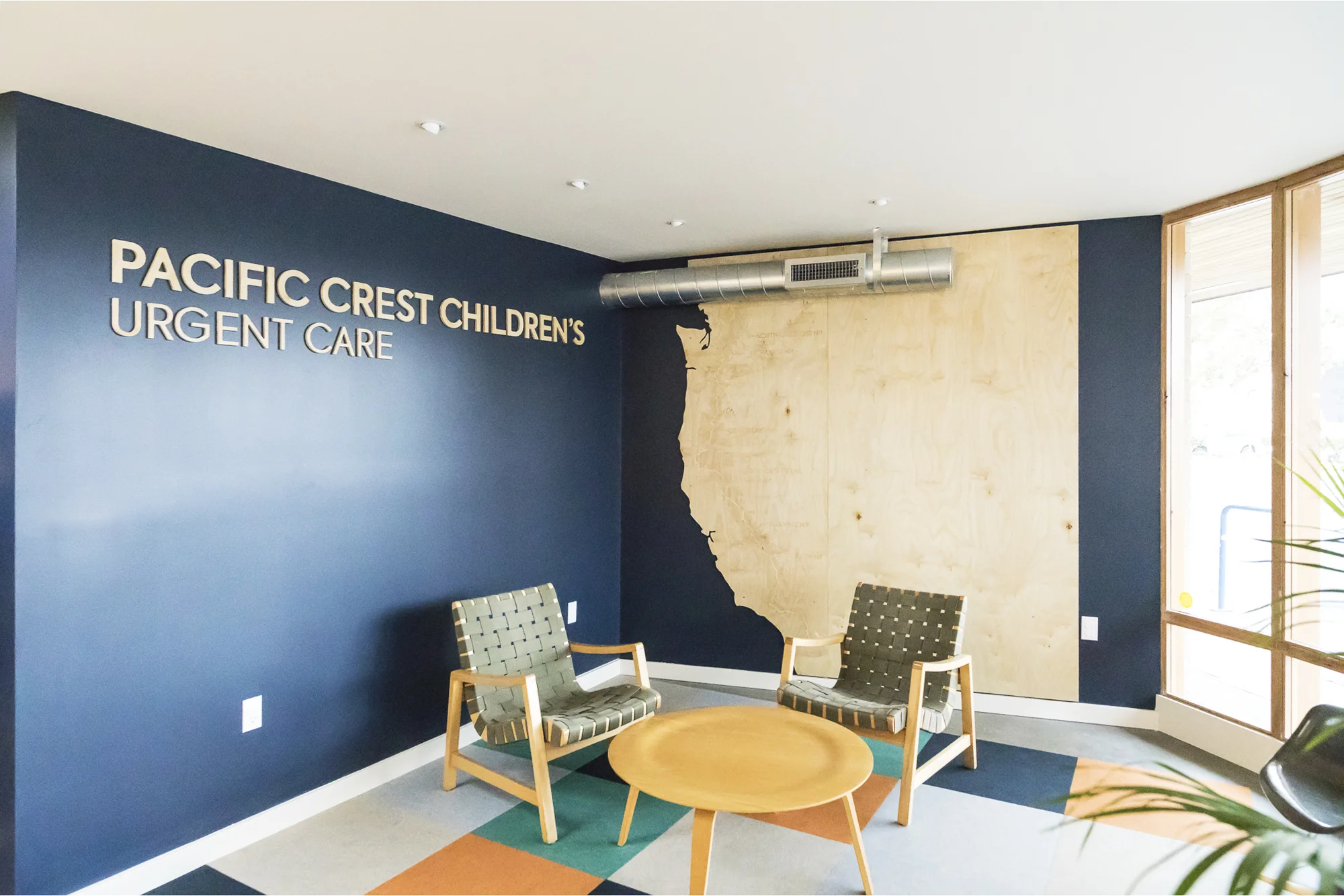The waiting room Pacific Crest Trail wall graphic engages children to explore the trail from Canada to Mexico.