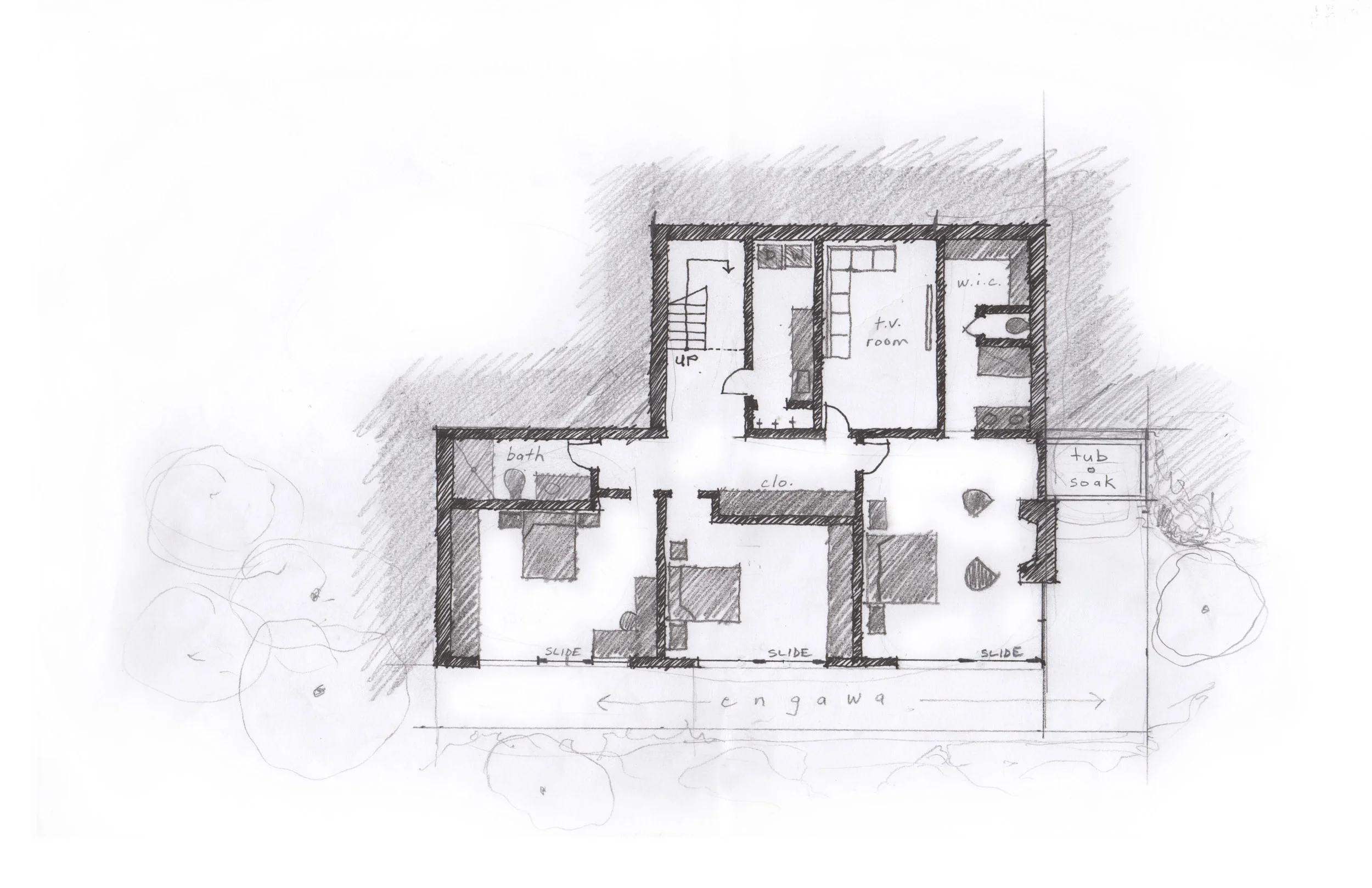 The lower level plan opens on to the engawa and garden while a Japanese soaking tub is nestled into the ground surrounded by landscaping and a rockery