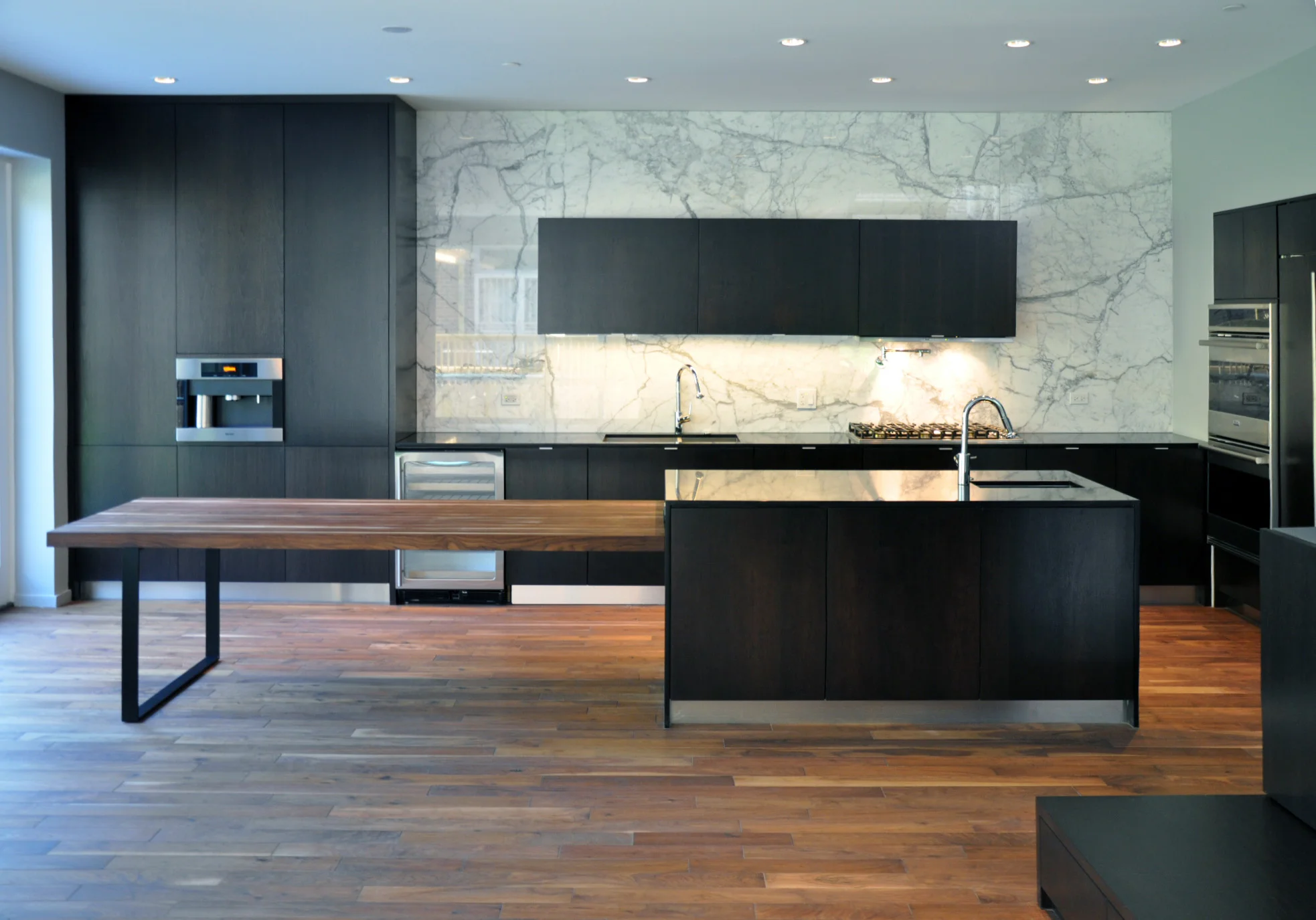An island + dining table create a gathering place in the new kitchen