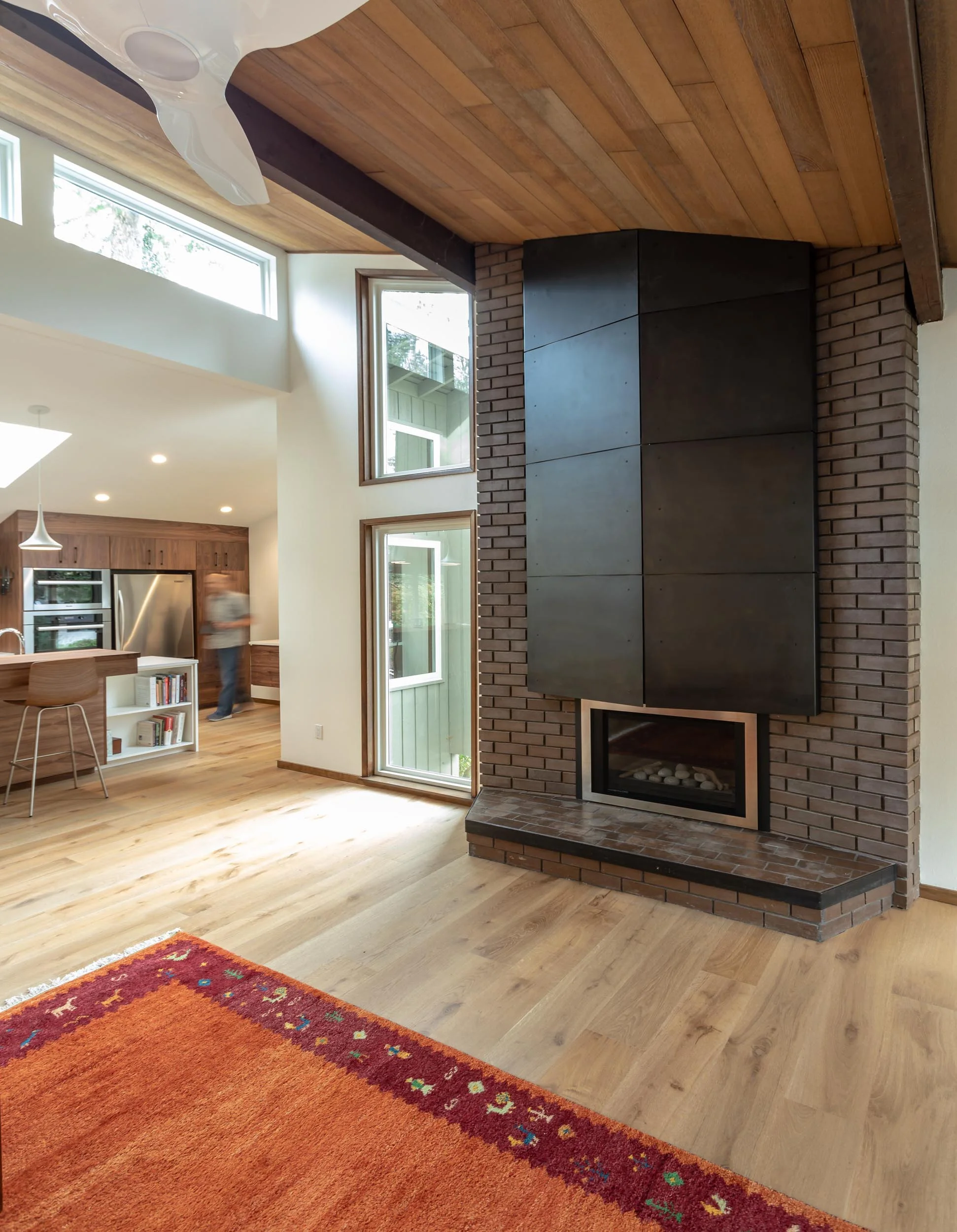 The original hearth was covered with wood shingles, something the owners were not excited about. They were looking for a contemporary upgrade. We worked together with a steel fabricator to install 1/8” steel panels with a gun metal finish.