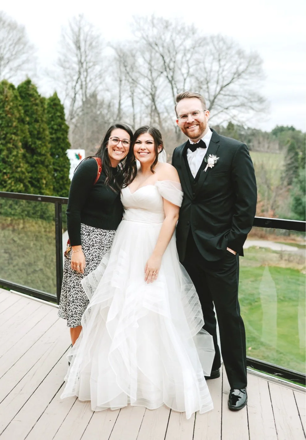 Wedding photographer in toronto poses with couple on their wedding day