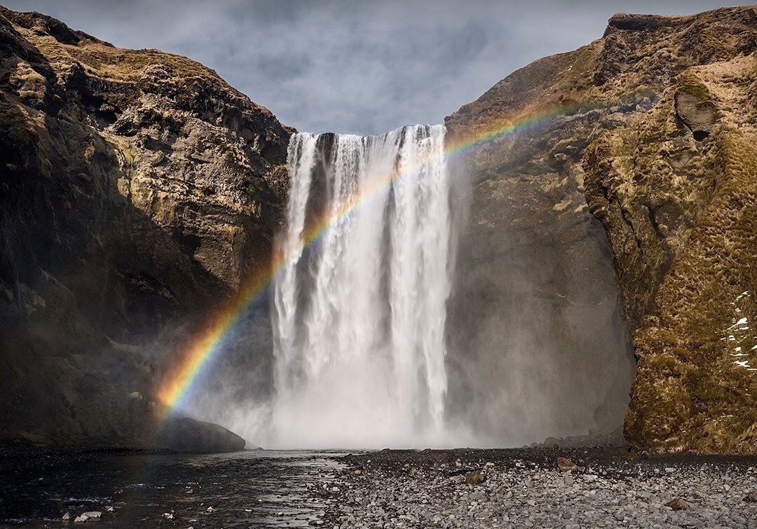 Skogafoss. Keeping with the winter theme, this is one of Iceland&rsquo;s best known waterfalls. Afternoon sun catches the spray to produce a rainbow. 
#visiticeland #skogafoss #icelandwaterfall#rainbowimages #icelandair