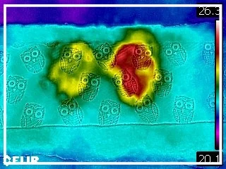 On the left is the temperature profile of a hand placed on foam treated with KulKote. On the right is a hand placed on basic foam. 