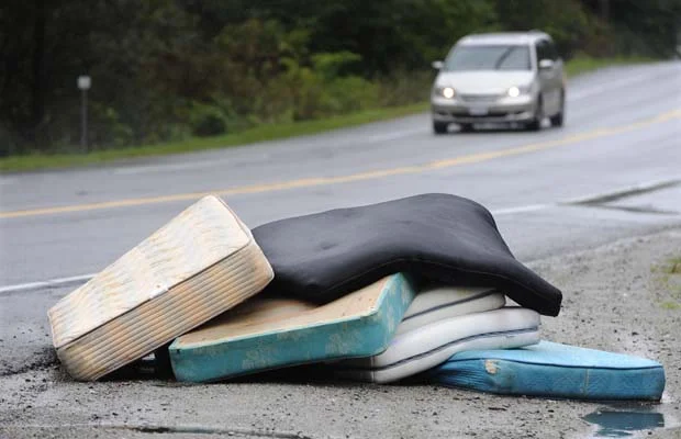 Mattresses by the side of the road. 