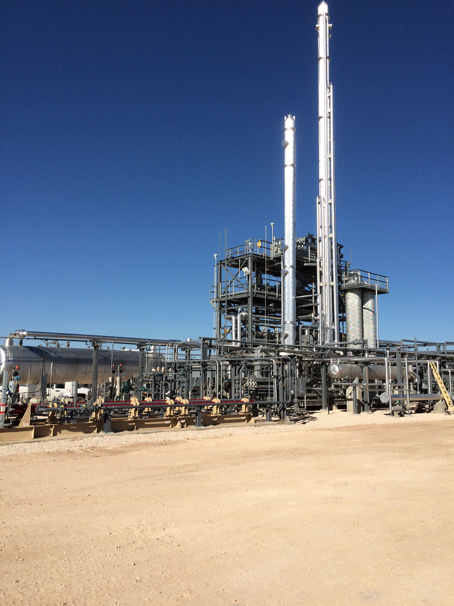 silver-two-column-energy-structure-in-dirt-road.jpg