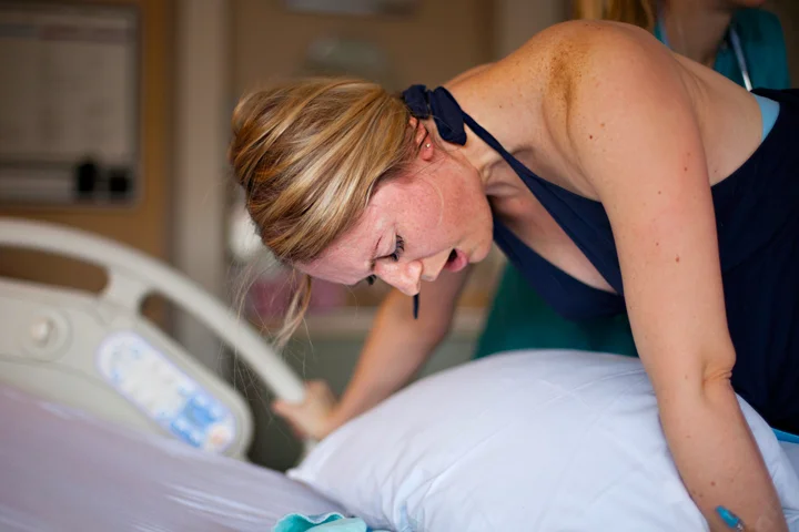 Shannon continues to work through intense contractions and I wonder aloud, "Where's Hal?" A nurse informs me that he's in the waiting room with their 2 year old son. Everything is happening so fast that the grandparents have yet to arrive. They're on toddler duty and it's not clear they'll get here in time.