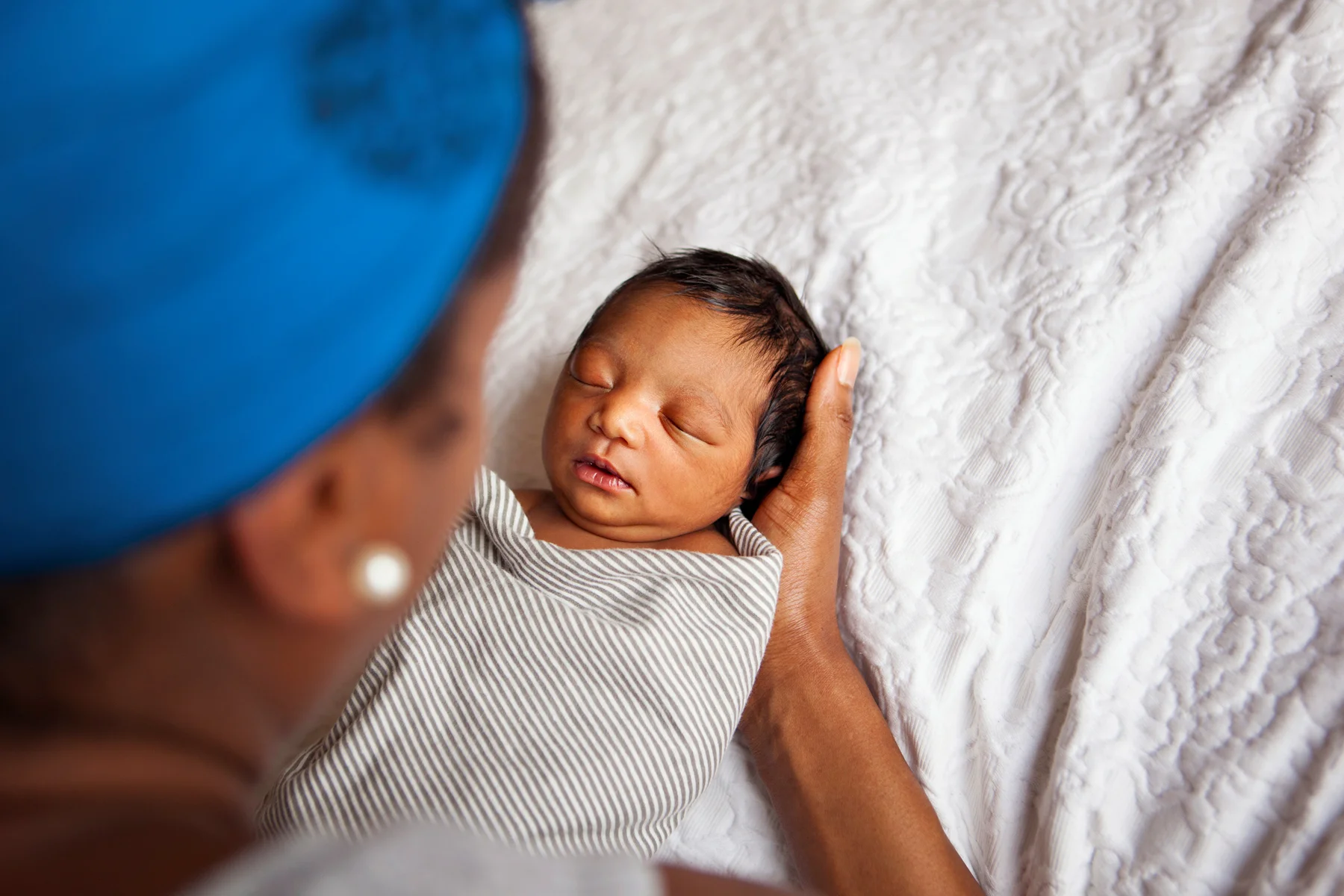 I love to photograph mamas and their babies from behind. That's how I always remember my babies. Staring down at them from that perspective for so many hours - you wonder if you can hold every detail of their faces forever in your mind. A photo like this feel like a memory.
