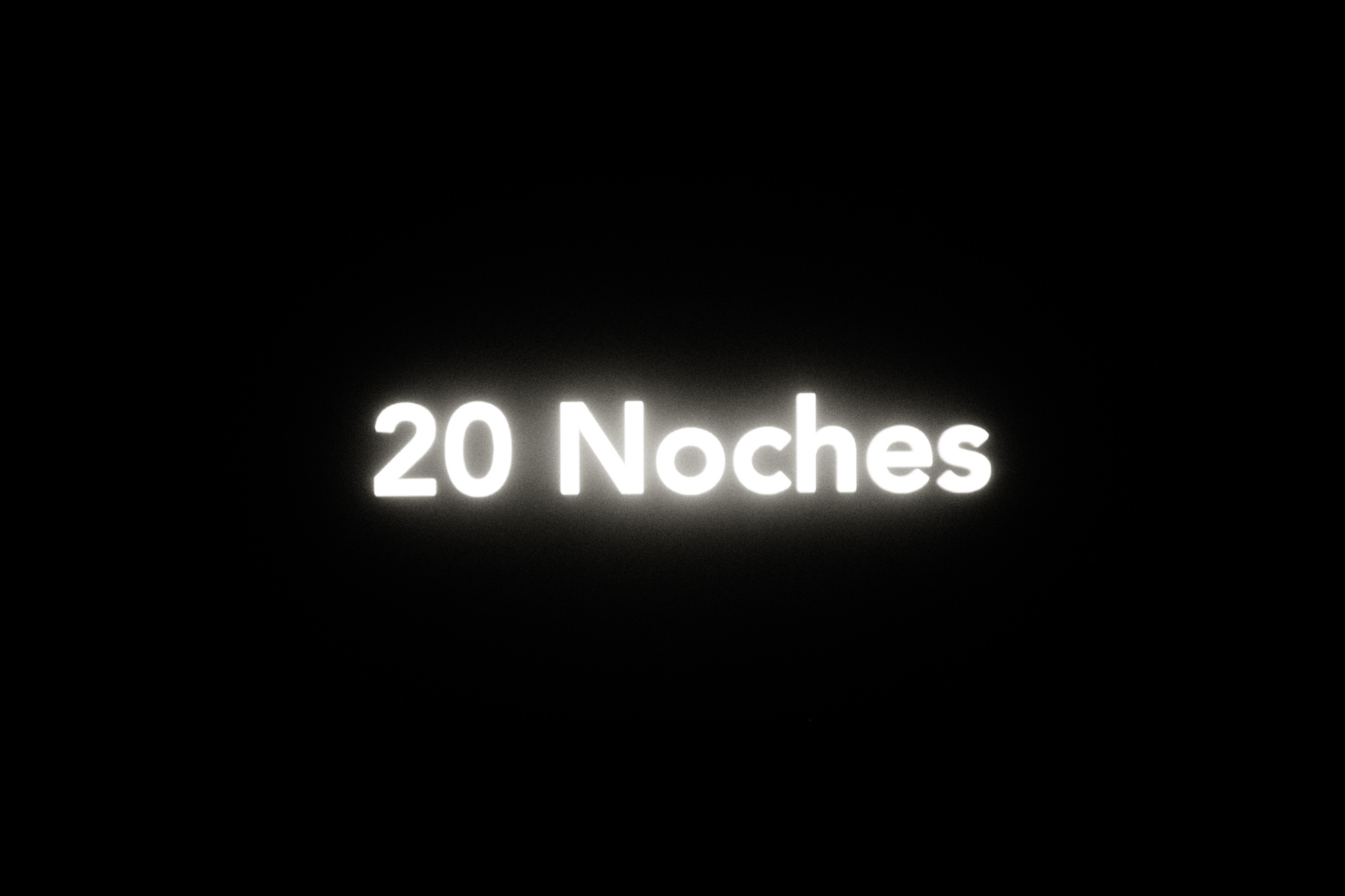  20 Noches (20 Nights) is a photo book and a poetry book at the same time. The project was born from the idea of using a portable projector during my night walks to cast words on the surface of the city. It is an encounter between street photography 