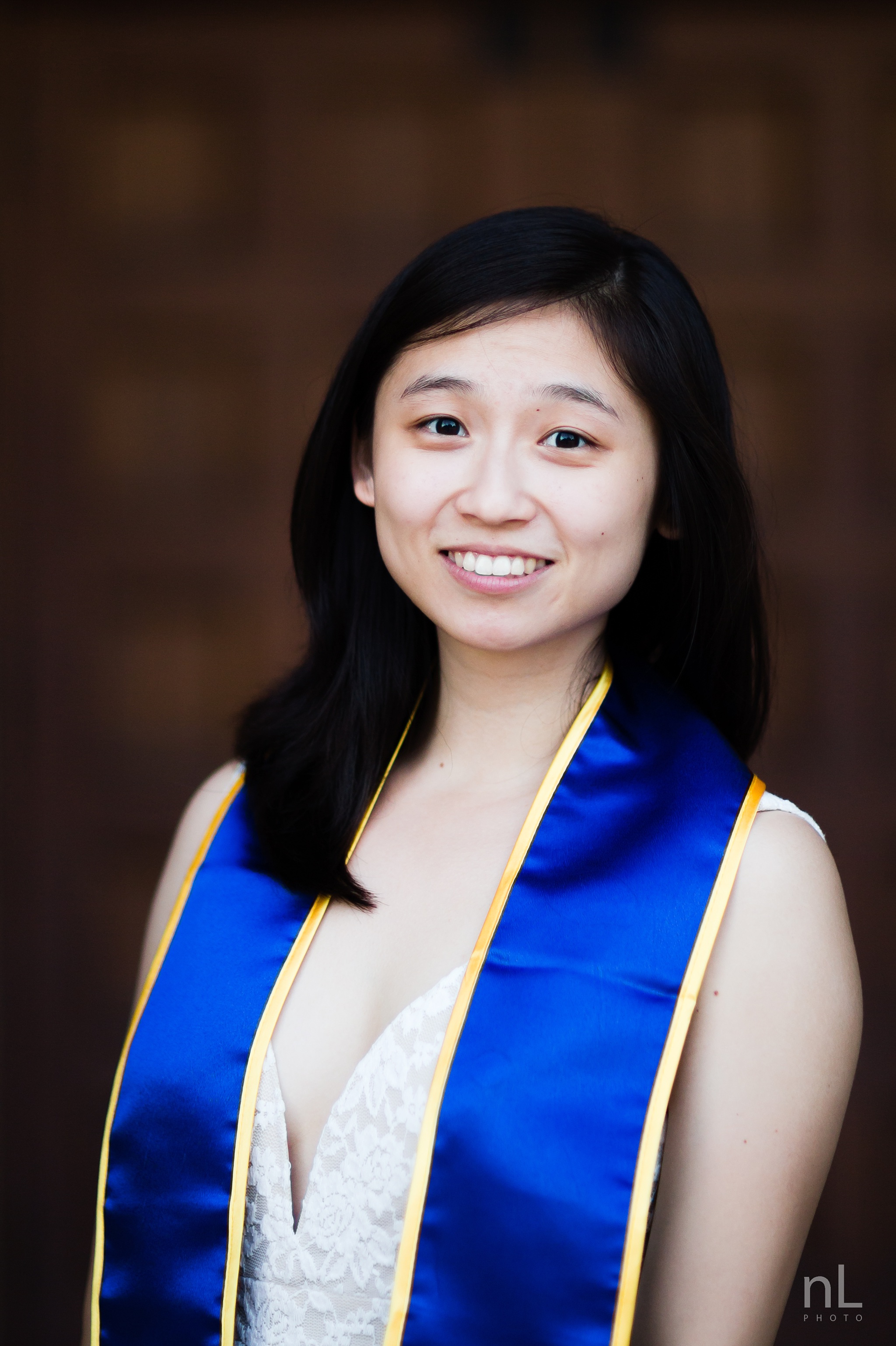 los angeles ucla senior graduation portrait girl in white dress at royce hall front doors