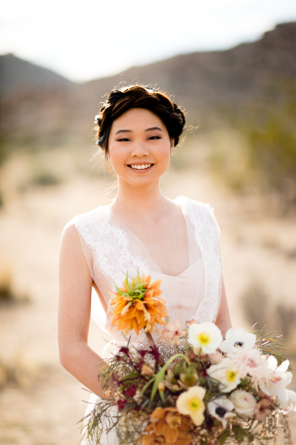 joshua-tree-engagement-wedding-elopement-photography-stylized-photoshoot-bridal-portrait-with-bouquet-dress-and-veil