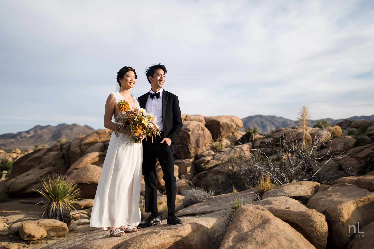 joshua-tree-engagement-wedding-elopement-photography-stylized-photoshoot-bride-and-groom-environmental-portrait-rock-formation