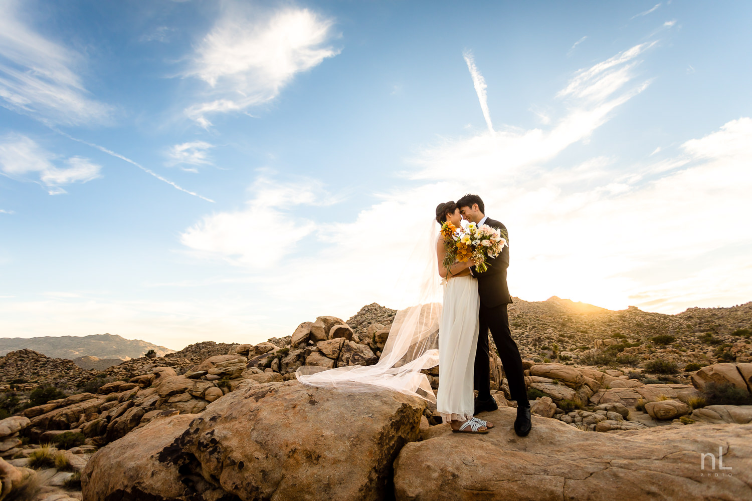 joshua-tree-engagement-wedding-elopement-photography-stylized-photoshoot-epic-environmental-portrait-bride-and-groom-rocks-at-sunset