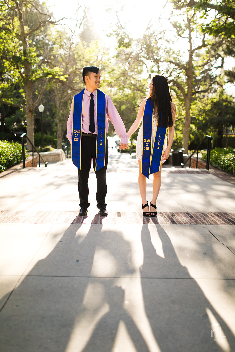 los-angeles-ucla-senior-graduation-portraits-bruinwalk-couple-sashes-sunset-shadows