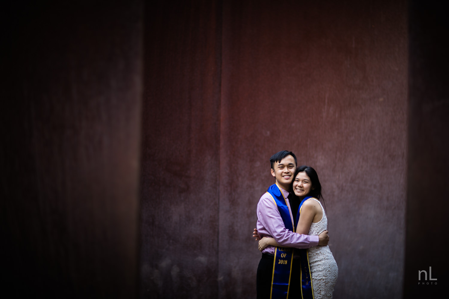 los-angeles-ucla-senior-graduation-portraits-couple-with-sashes-hugging