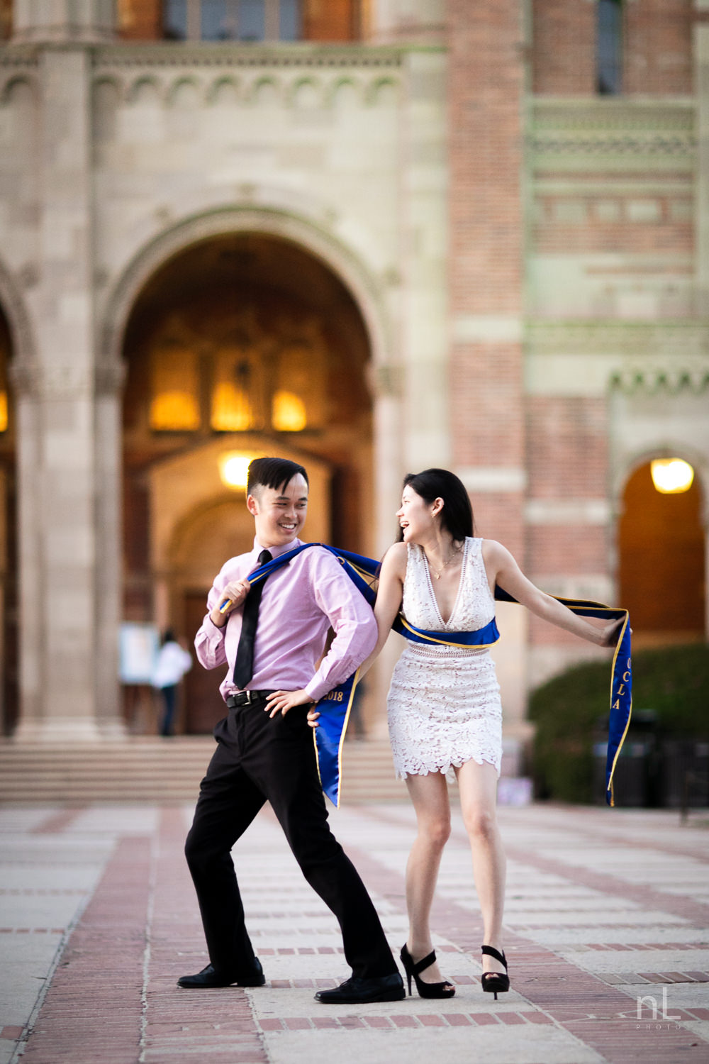 los-angeles-ucla-senior-graduation-portraits-couple-royce-hall-epic-funny-sashes-shot