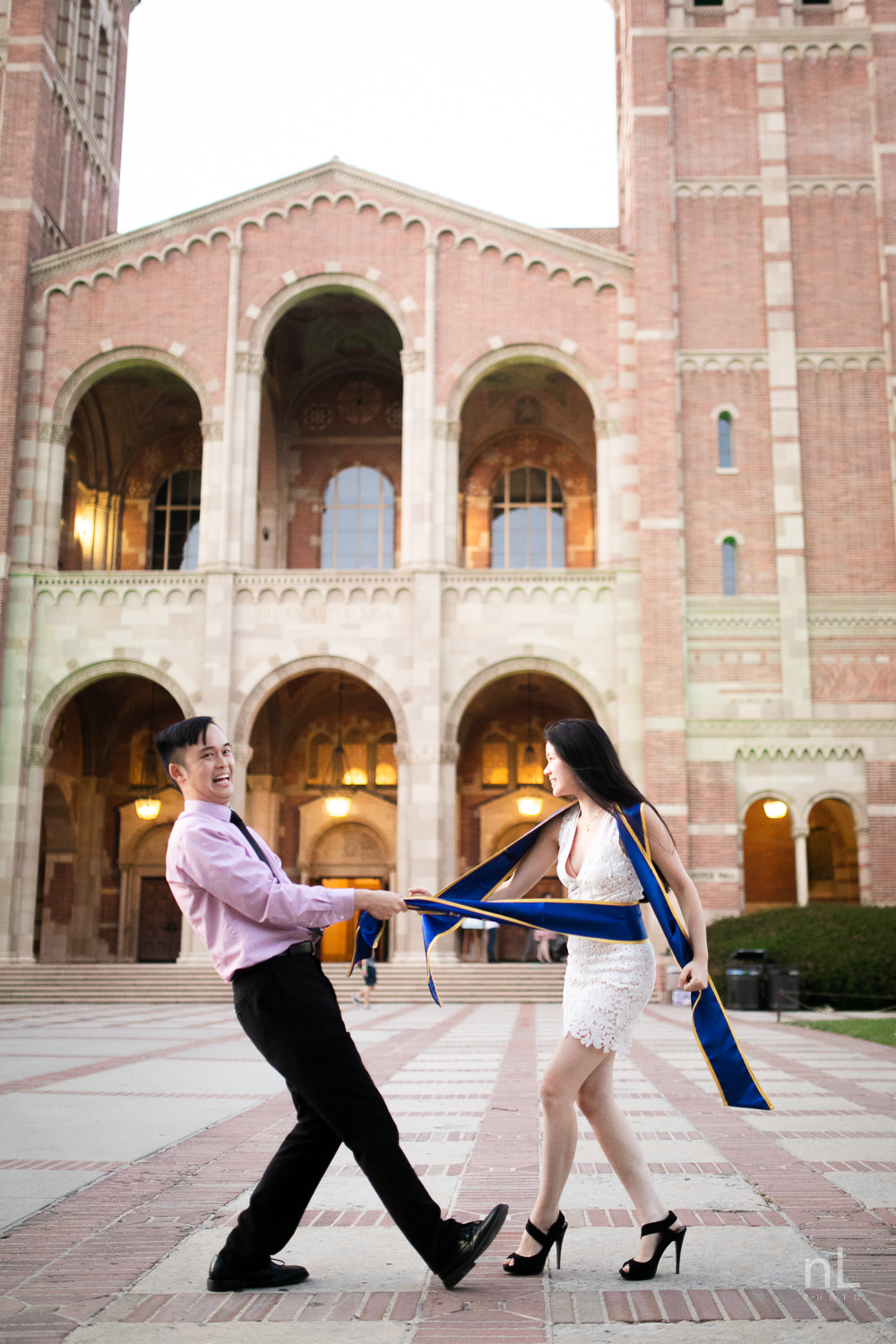 los-angeles-ucla-senior-graduation-portraits-couple-royce-hall-epic-funny-sashes-shot