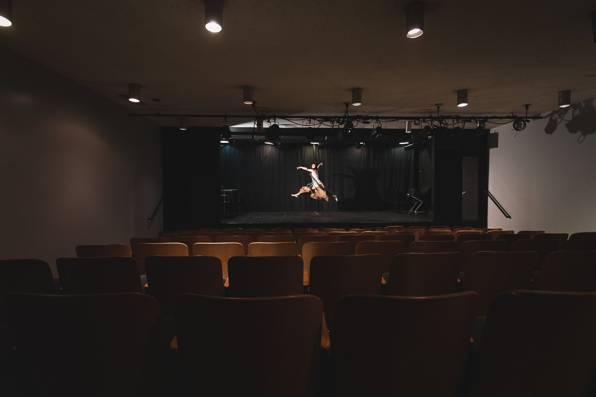 UCLA artistic graduation portraits of studio dancer on theater stage