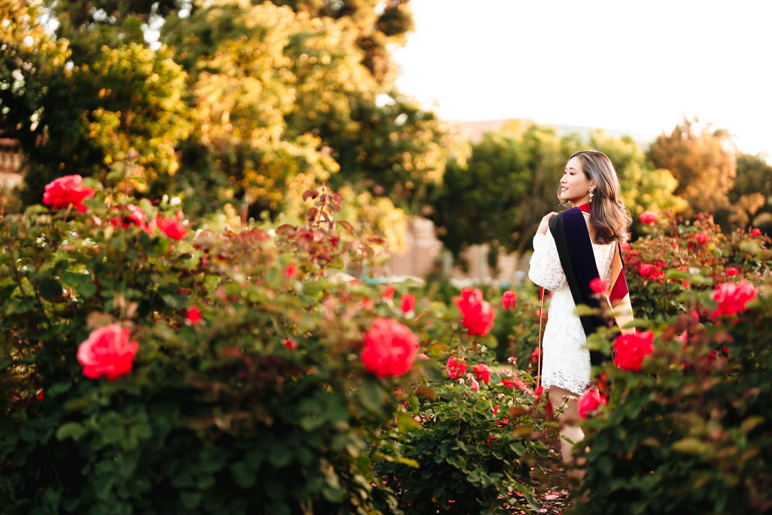 Dreamy graduation portrait at USC Rose Garden at sunset