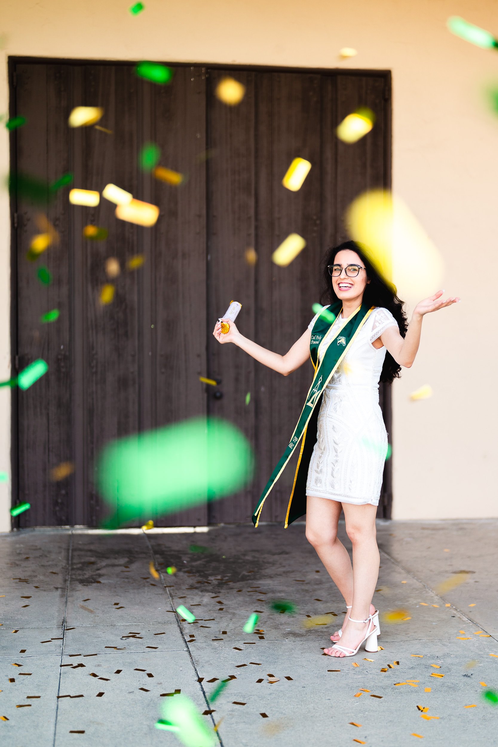 Fun graduation portrait with confetti at Cal Poly Pomona