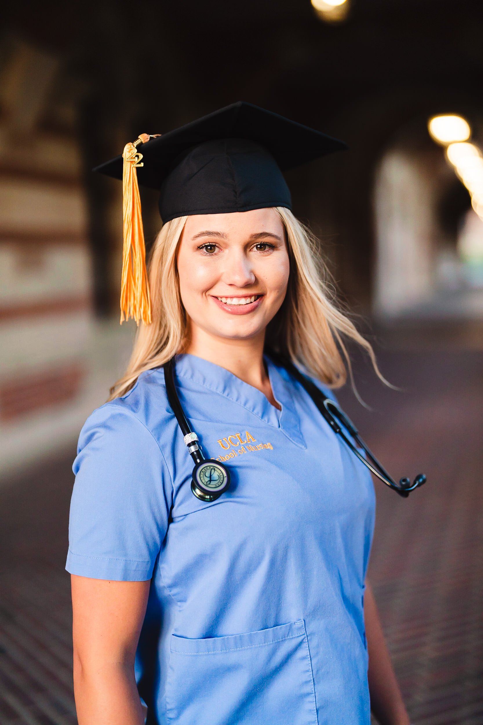 Graduation portrait of nursing student with scrubs