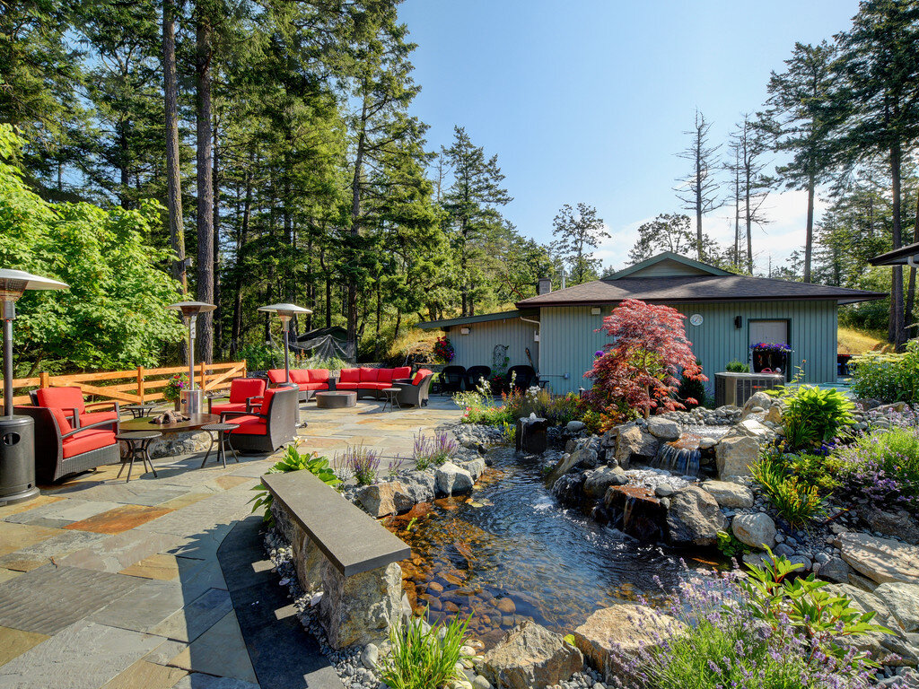 2-outdoor-patio-living-granite-pond-backyard-japanese-maple-capstone-salvia-blue-stone.jpg