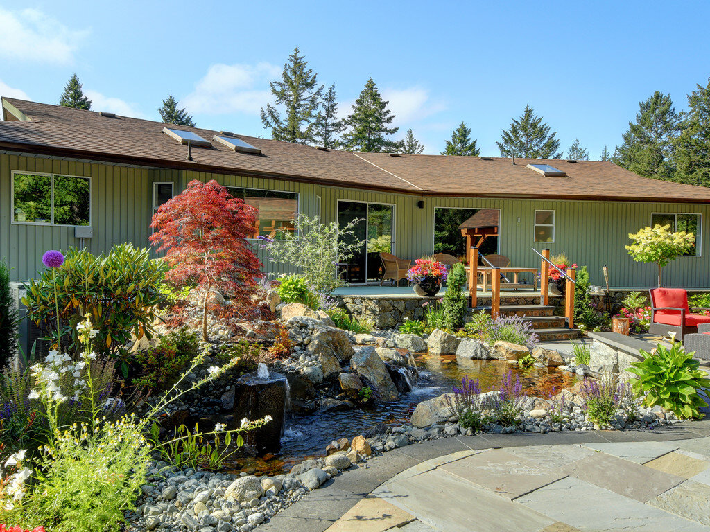 water-feature-granite-pond-japanese-maple-begonia-outdoor-steps-salvia-interlocking-bricks-pavers-blue-stone.jpg