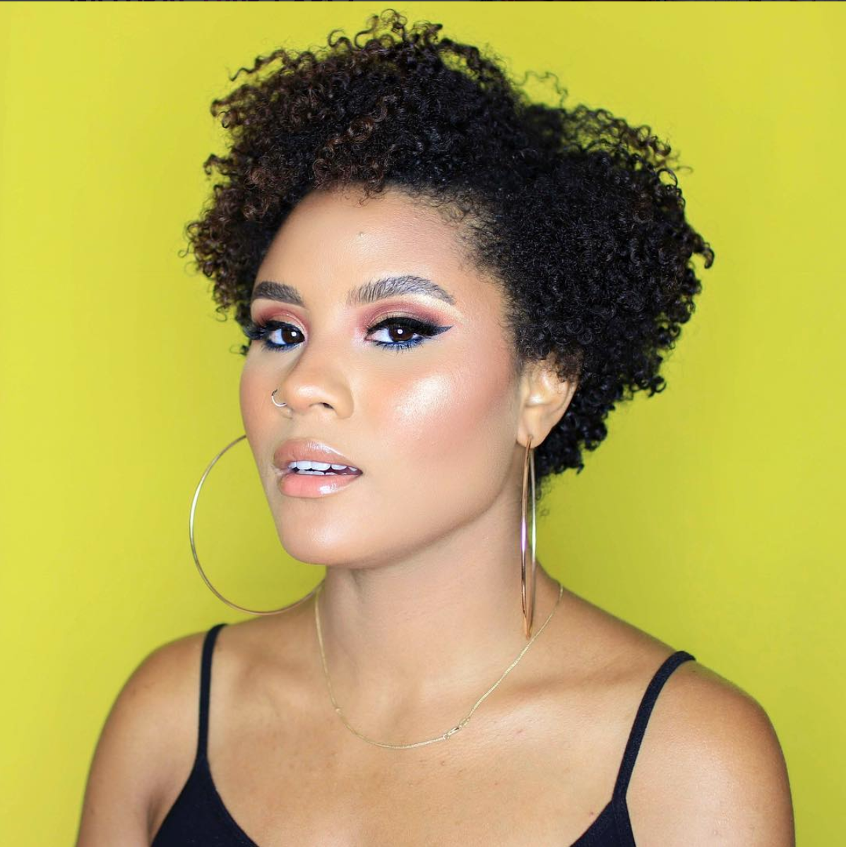 Ashley is a true New York native, coming from the Bronx to be exact. She is known for her springy curls, edgy vibes and out of this world glow. Her talents include doing a full face beat (with lashes) while holding a compact mirror and memorizing Beyoncé choreography. When Ashley isn't playing in makeup, she's cuddled up with her boyfriend and fur babies, Chloe and Maison.